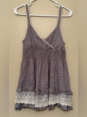 Grey babydoll tank top with lace layer and tiered ruffle bottom